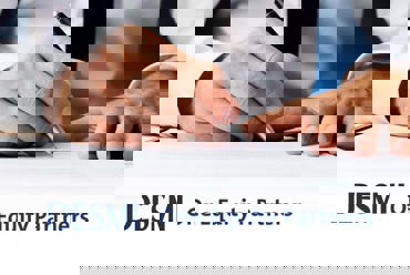 Person signing document with DESMI and One Equity Partners logos visible.