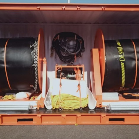 DESMI oil spill recovery equipment in an open shipping container for fluid handling.