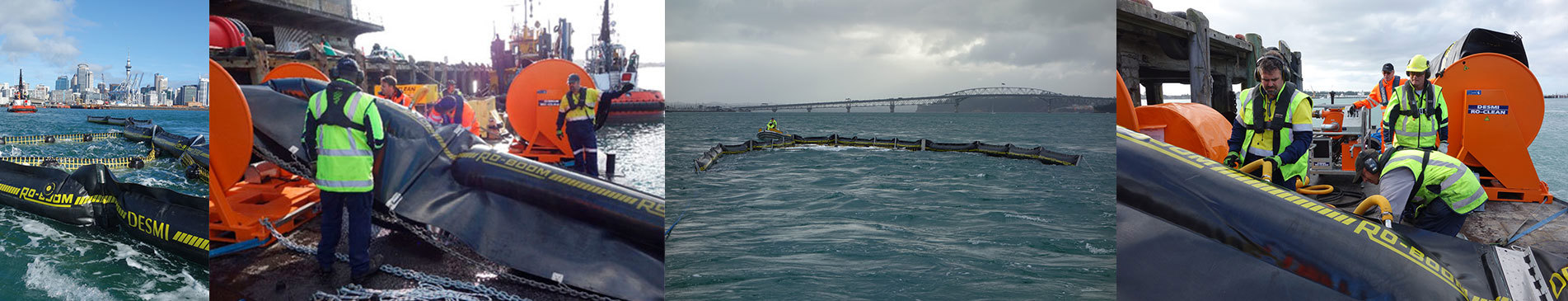 Workers deploying DESMI RO-BOOM for marine oil spill containment near a city harbor.