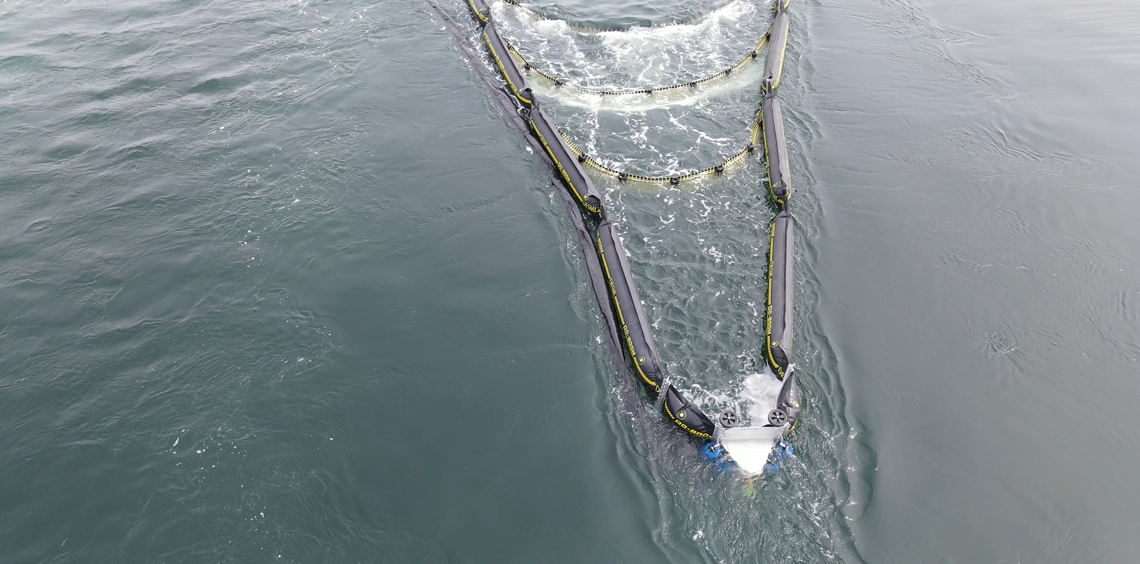 DESMI oil spill recovery skimmer operating on water surface.