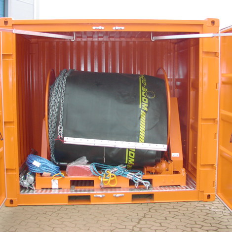 Open orange container with coiled industrial hose and chains inside.