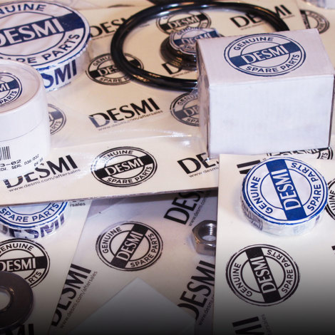 DESMI genuine spare parts packaging, including seals and rings, for fluid handling.