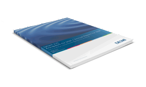 DESMI A/S Annual Report 2021, featuring a blue cover with ripple design.